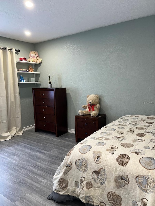 5826 Peregrine Ave Unit F01, Orlando, FL 32819 - bedroom with wood finished floors and baseboards