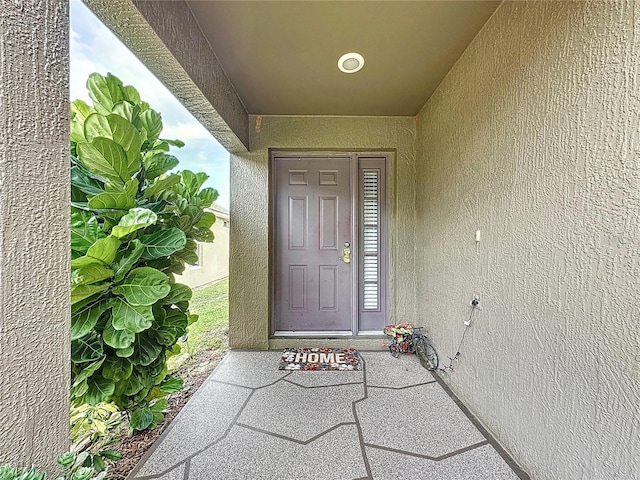 1364 Rebecca Dr, Haines City, FL 33844 - doorway to property with stucco siding