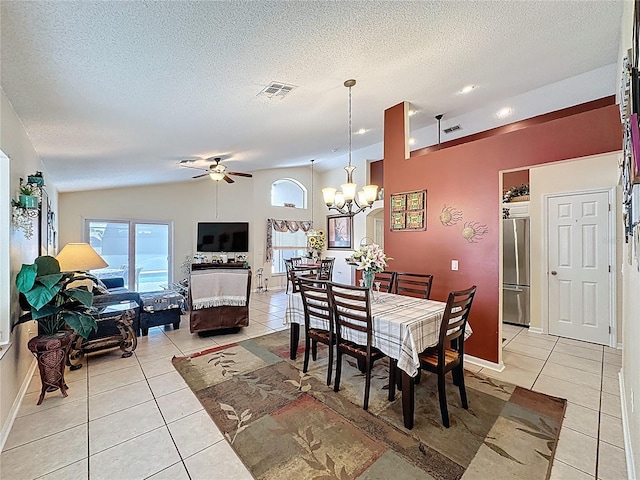1364 Rebecca Dr, Haines City, FL 33844 - dining room with light tile patterned floors, ceiling fan, healthy amount of natural light, a chandelier, and a textured ceiling