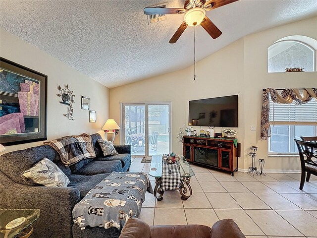 1364 Rebecca Dr, Haines City, FL 33844 - living room featuring lofted ceiling, tile patterned floors, a textured ceiling, plenty of natural light, and ceiling fan