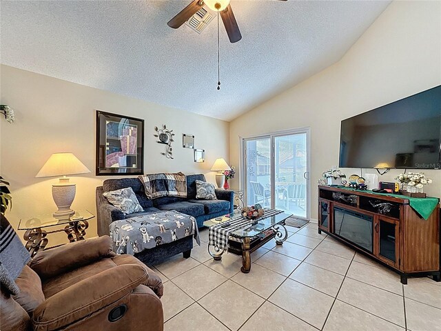 1364 Rebecca Dr, Haines City, FL 33844 - living area with lofted ceiling, a textured ceiling, ceiling fan, and light tile patterned floors