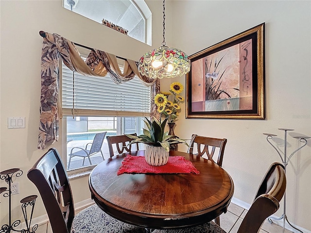 1364 Rebecca Dr, Haines City, FL 33844 - dining space with baseboards, a chandelier, and tile patterned flooring