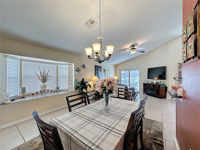 1364 Rebecca Dr, Haines City, FL 33844 - dining space with a chandelier, a textured ceiling, light tile patterned flooring, and ceiling fan