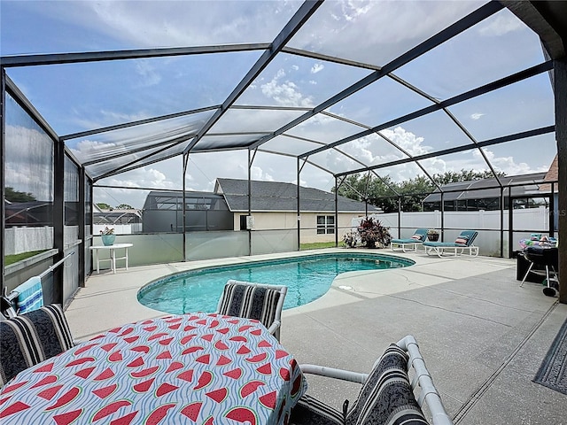 1364 Rebecca Dr, Haines City, FL 33844 - view of swimming pool featuring a patio, a fenced backyard, and glass enclosure