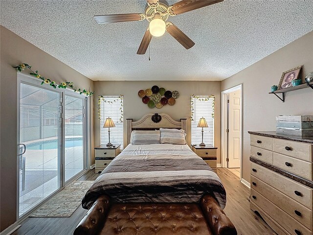 1364 Rebecca Dr, Haines City, FL 33844 - bedroom with access to exterior, light wood finished floors, a textured ceiling, and ceiling fan