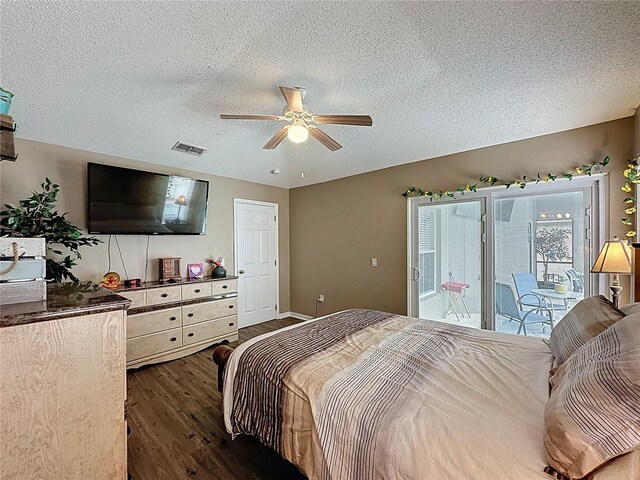 1364 Rebecca Dr, Haines City, FL 33844 - bedroom featuring dark wood-style flooring, a textured ceiling, and a ceiling fan