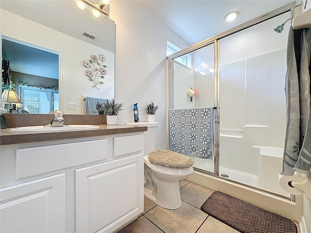 1364 Rebecca Dr, Haines City, FL 33844 - full bathroom with a shower stall, tile patterned flooring, toilet, and vanity