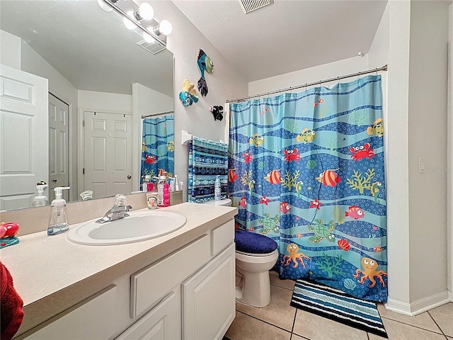 1364 Rebecca Dr, Haines City, FL 33844 - full bathroom with tile patterned floors, toilet, vanity, and a shower with curtain