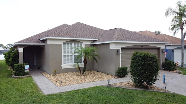 1364 Rebecca Dr, Haines City, FL 33844 - view of front of house with a shingled roof, a garage, stucco siding, concrete driveway, and a front lawn