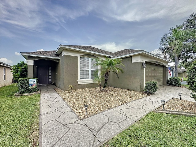 1364 Rebecca Dr, Haines City, FL 33844 - view of front facade with stucco siding, an attached garage, a front yard, and concrete driveway