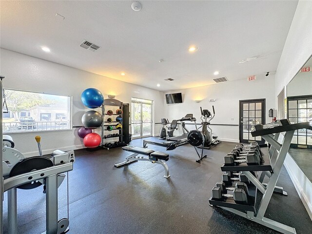 1364 Rebecca Dr, Haines City, FL 33844 - gym with plenty of natural light, recessed lighting, baseboards, and french doors
