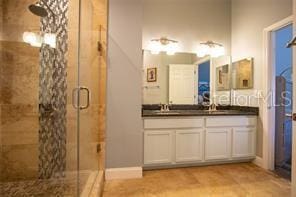 3030 Eagle Crossing Dr, Kissimmee, FL 34746 - full bathroom with a stall shower and double vanity