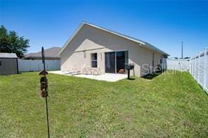 3030 Eagle Crossing Dr, Kissimmee, FL 34746 - rear view of property featuring a patio