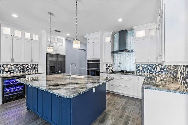 3427 Harborside Ct, Kissimmee, FL 34746 - kitchen featuring wine cooler, wall chimney range hood, black appliances, dark wood-type flooring, and tasteful backsplash
