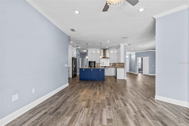 3427 Harborside Ct, Kissimmee, FL 34746 - unfurnished living room with ornamental molding, recessed lighting, ceiling fan, and dark wood-style flooring