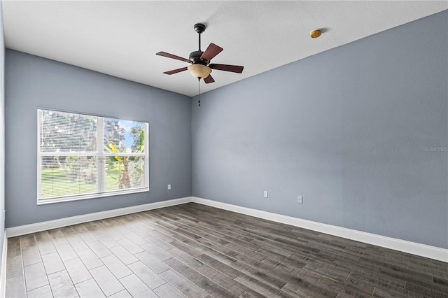 3427 Harborside Ct, Kissimmee, FL 34746 - spare room featuring ceiling fan, dark wood-style flooring, and a smoke detector