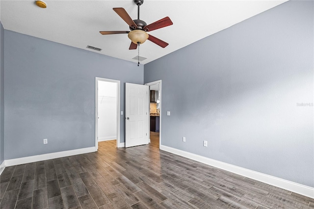 3427 Harborside Ct, Kissimmee, FL 34746 - spare room featuring dark wood-style floors and ceiling fan