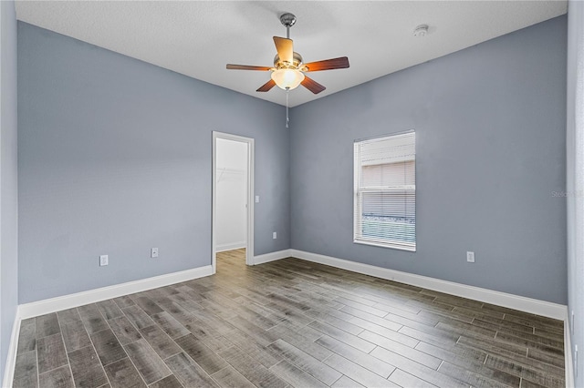 3427 Harborside Ct, Kissimmee, FL 34746 - spare room with dark wood-style flooring, ceiling fan, and a smoke detector