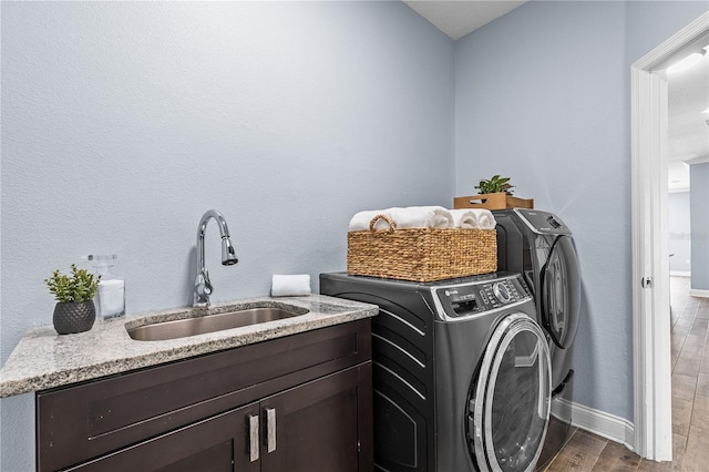 3427 Harborside Ct, Kissimmee, FL 34746 - laundry area with wood finished floors, independent washer and dryer, and cabinet space
