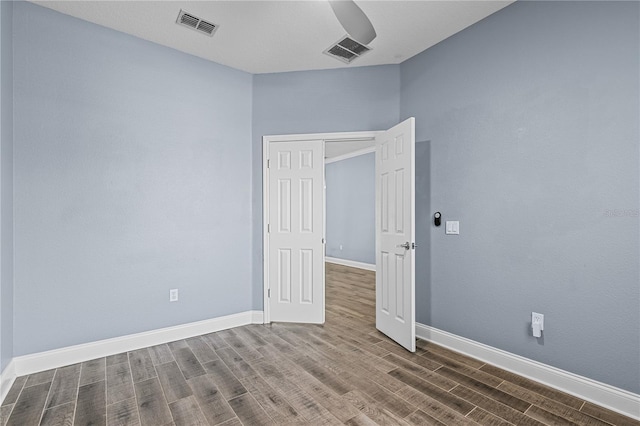 3427 Harborside Ct, Kissimmee, FL 34746 - spare room featuring wood finished floors and baseboards