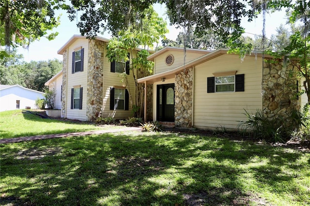 1843 Harbor Blvd, Kissimmee, FL 34744 - view of front of house with a front lawn and stone siding