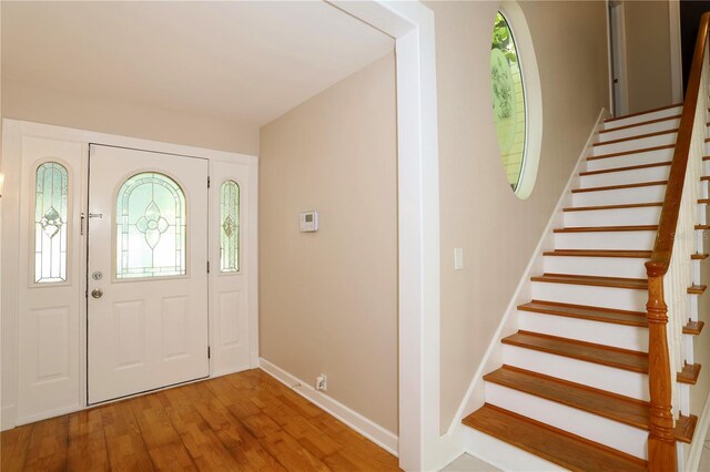 1843 Harbor Blvd, Kissimmee, FL 34744 - foyer entrance featuring stairway and light wood finished floors