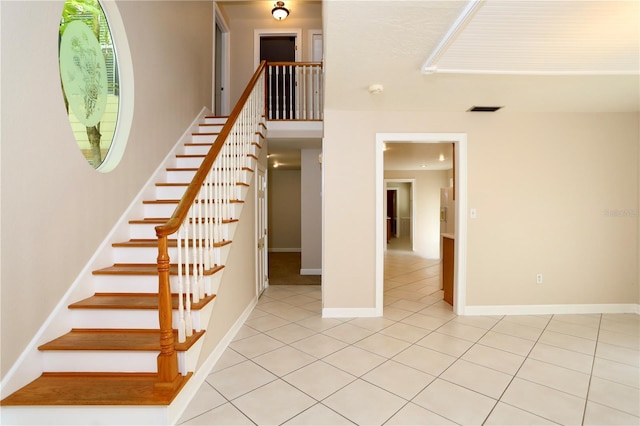 1843 Harbor Blvd, Kissimmee, FL 34744 - staircase with tile patterned floors and baseboards