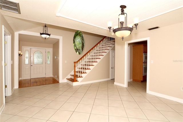 1843 Harbor Blvd, Kissimmee, FL 34744 - foyer featuring stairway and light tile patterned flooring