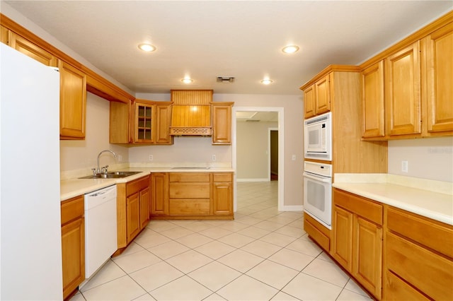 1843 Harbor Blvd, Kissimmee, FL 34744 - kitchen featuring white appliances, recessed lighting, light countertops, light tile patterned flooring, and glass insert cabinets