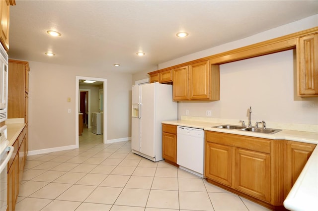 1843 Harbor Blvd, Kissimmee, FL 34744 - kitchen with white appliances, light countertops, washer / dryer, recessed lighting, and light tile patterned floors