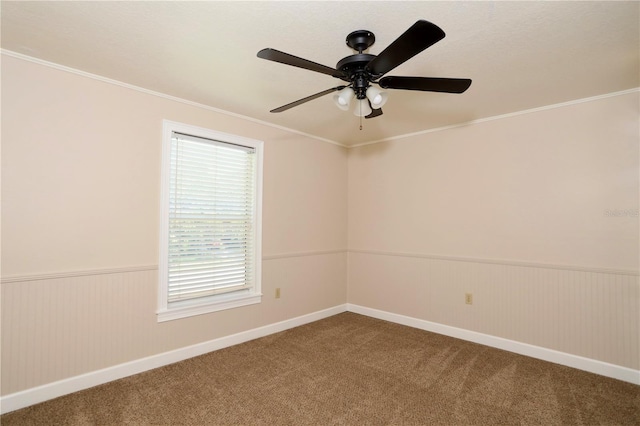1843 Harbor Blvd, Kissimmee, FL 34744 - unfurnished room with wainscoting, carpet floors, a ceiling fan, and ornamental molding