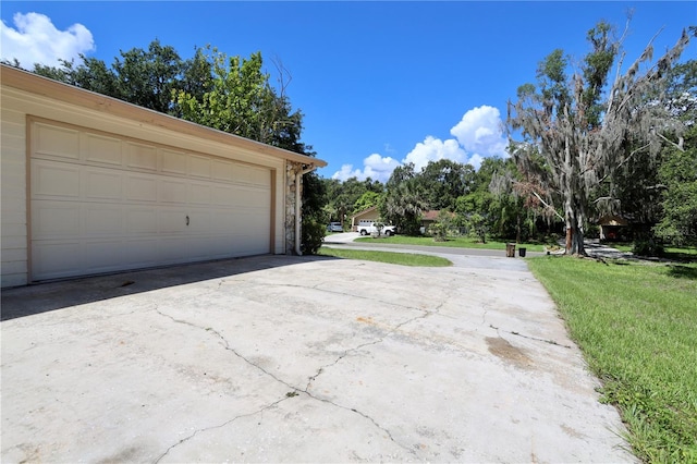 1843 Harbor Blvd, Kissimmee, FL 34744 - garage featuring view of wooded area