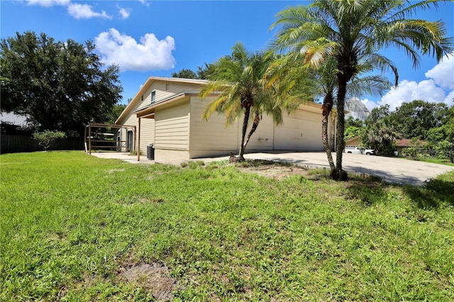 1843 Harbor Blvd, Kissimmee, FL 34744 - view of property exterior with a garage and driveway