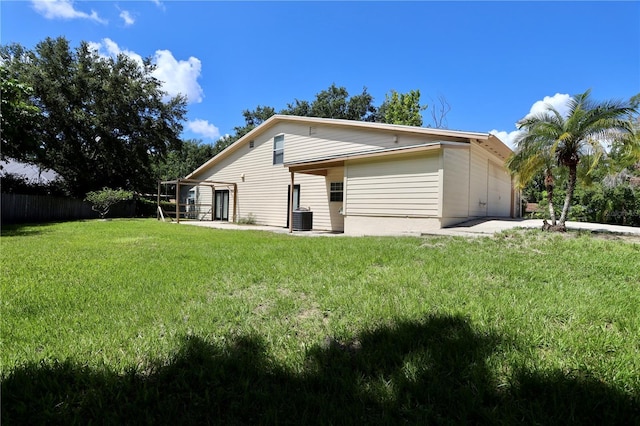 1843 Harbor Blvd, Kissimmee, FL 34744 - view of home's exterior with a garage and a patio