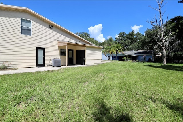 1843 Harbor Blvd, Kissimmee, FL 34744 - view of grassy yard with a patio