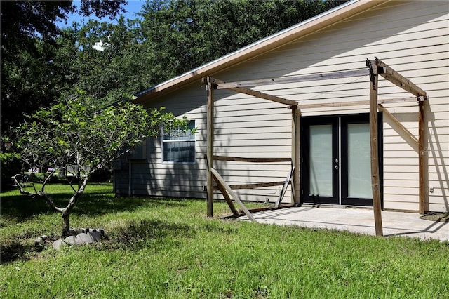 1843 Harbor Blvd, Kissimmee, FL 34744 - view of side of home with a yard and a patio area