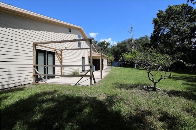 1843 Harbor Blvd, Kissimmee, FL 34744 - view of grassy yard with a patio