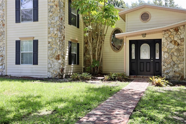 1843 Harbor Blvd, Kissimmee, FL 34744 - entrance to property featuring stone siding and a yard