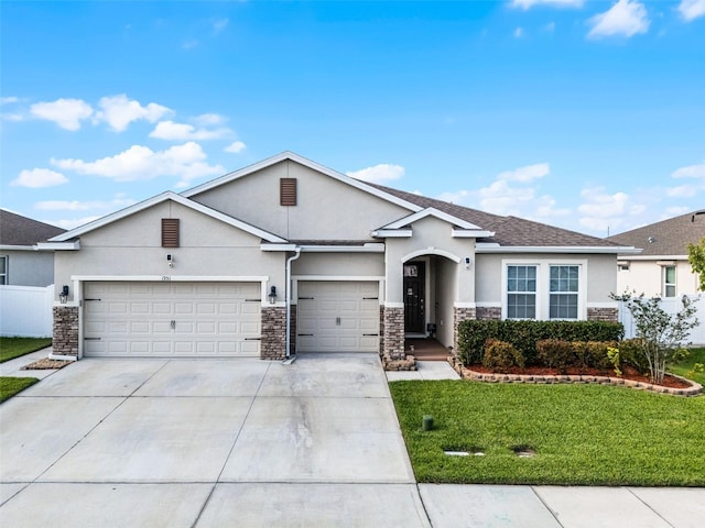 1951 Partin Terrace Rd, Kissimmee, FL 34744 - ranch-style house featuring stone siding, stucco siding, a garage, and driveway