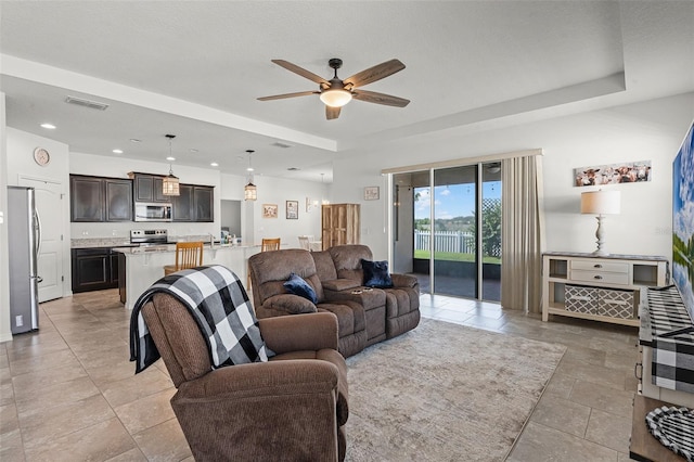 1951 Partin Terrace Rd, Kissimmee, FL 34744 - living room with ceiling fan, recessed lighting, and light tile patterned floors