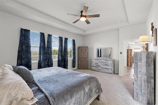 1951 Partin Terrace Rd, Kissimmee, FL 34744 - carpeted bedroom with a raised ceiling, baseboards, and a ceiling fan