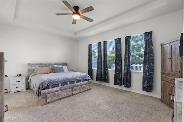 1951 Partin Terrace Rd, Kissimmee, FL 34744 - carpeted bedroom with a tray ceiling and ceiling fan