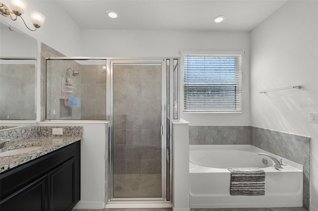 1951 Partin Terrace Rd, Kissimmee, FL 34744 - bathroom featuring vanity, a garden tub, a shower stall, and recessed lighting
