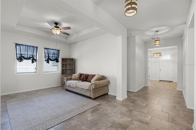 1951 Partin Terrace Rd, Kissimmee, FL 34744 - sitting room with baseboards, plenty of natural light, ceiling fan, and a tray ceiling