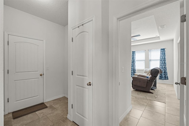 1951 Partin Terrace Rd, Kissimmee, FL 34744 - hall with a textured ceiling and baseboards