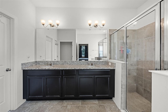 1951 Partin Terrace Rd, Kissimmee, FL 34744 - bathroom featuring double vanity, a stall shower, and a chandelier