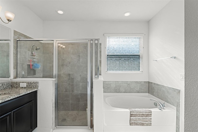 1951 Partin Terrace Rd, Kissimmee, FL 34744 - full bath featuring a bath, vanity, a stall shower, and recessed lighting