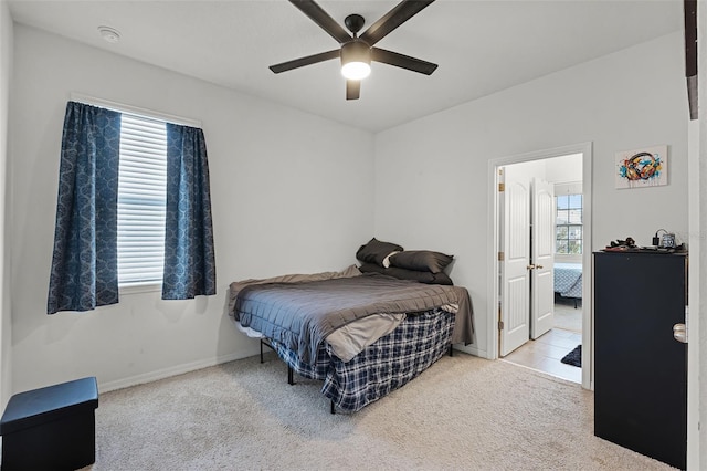 1951 Partin Terrace Rd, Kissimmee, FL 34744 - carpeted bedroom with baseboards and a ceiling fan