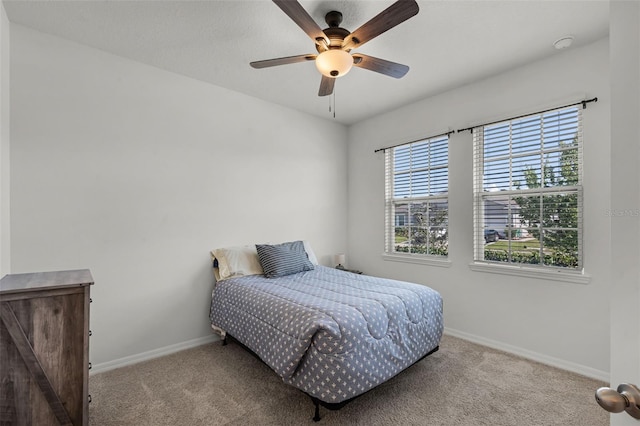 1951 Partin Terrace Rd, Kissimmee, FL 34744 - carpeted bedroom featuring multiple windows, baseboards, and ceiling fan