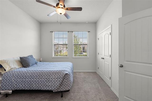 1951 Partin Terrace Rd, Kissimmee, FL 34744 - bedroom featuring carpet flooring, baseboards, a ceiling fan, and a textured ceiling